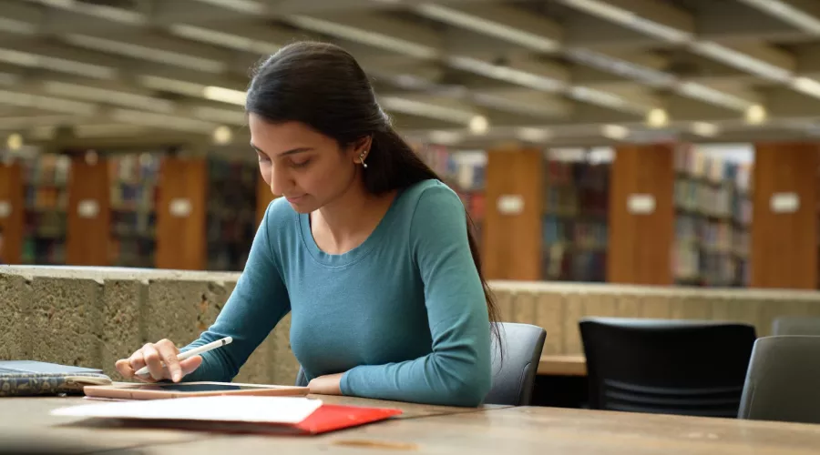 Student studying in the library.