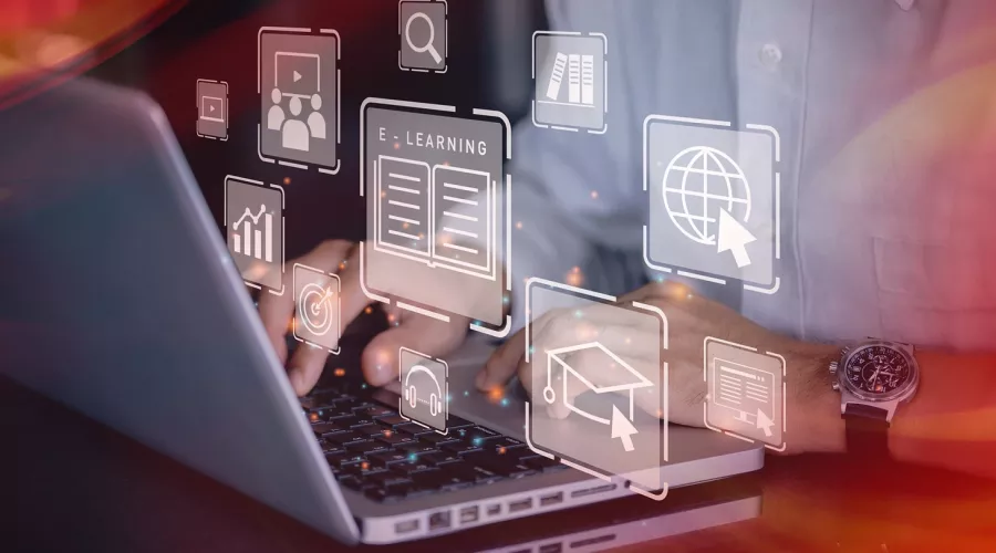 Man using a laptop with abstract online learning overlay.